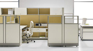 Front view of white and tan colored refurbished cubicles in a office.