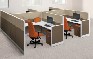 group of four brown office cubicles with orange chairs