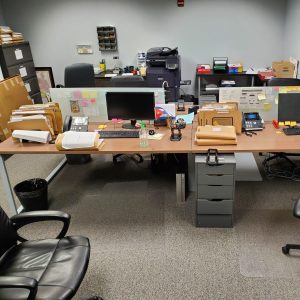 Wooden topped office workstations with chairs