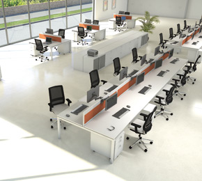 Top view of large workstations with white tables and black chairs.